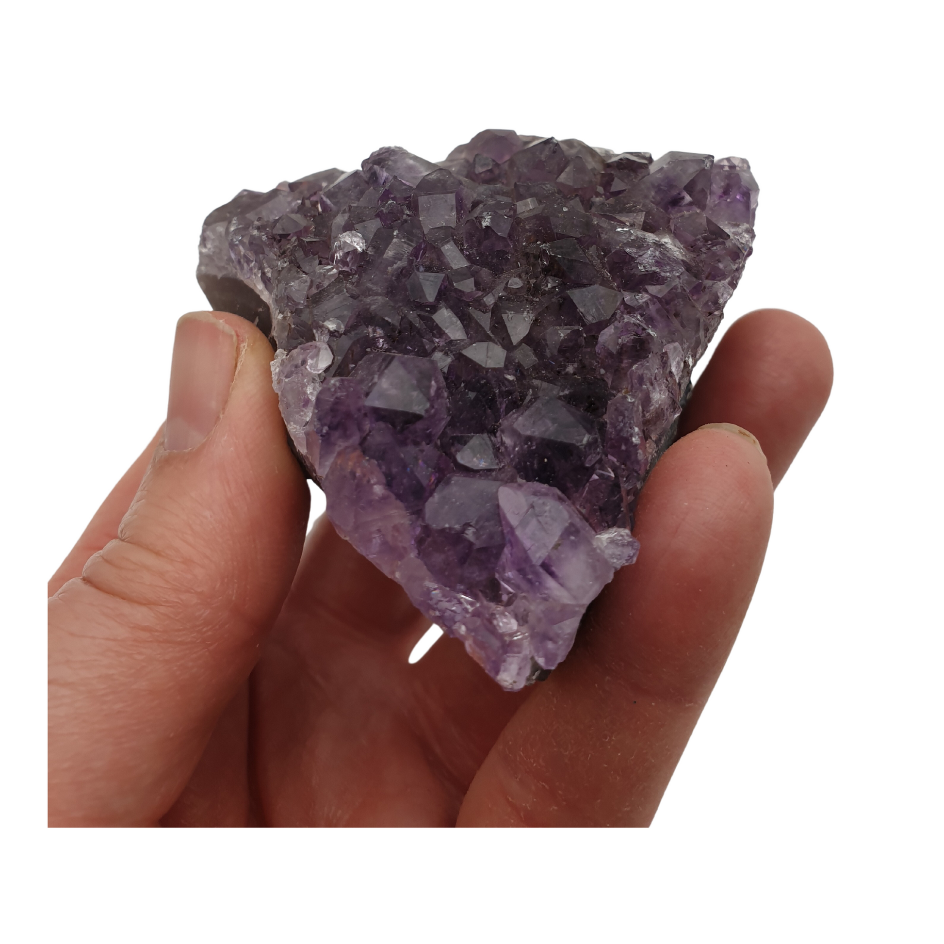 A hand holding a piece of amethyst with purple points on a base of grey stone