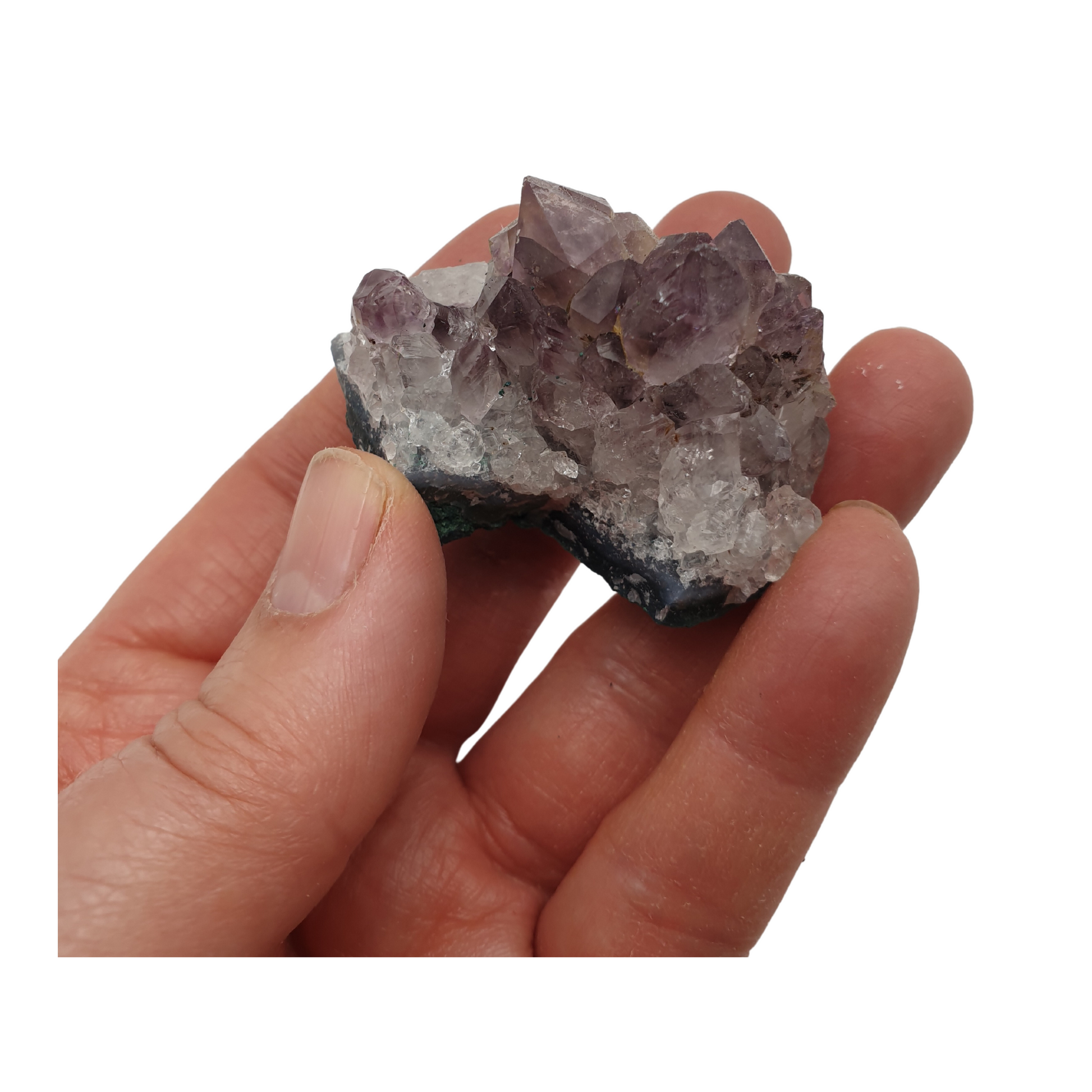 A hand holding a piece of amethyst with purple points on a base of grey stone