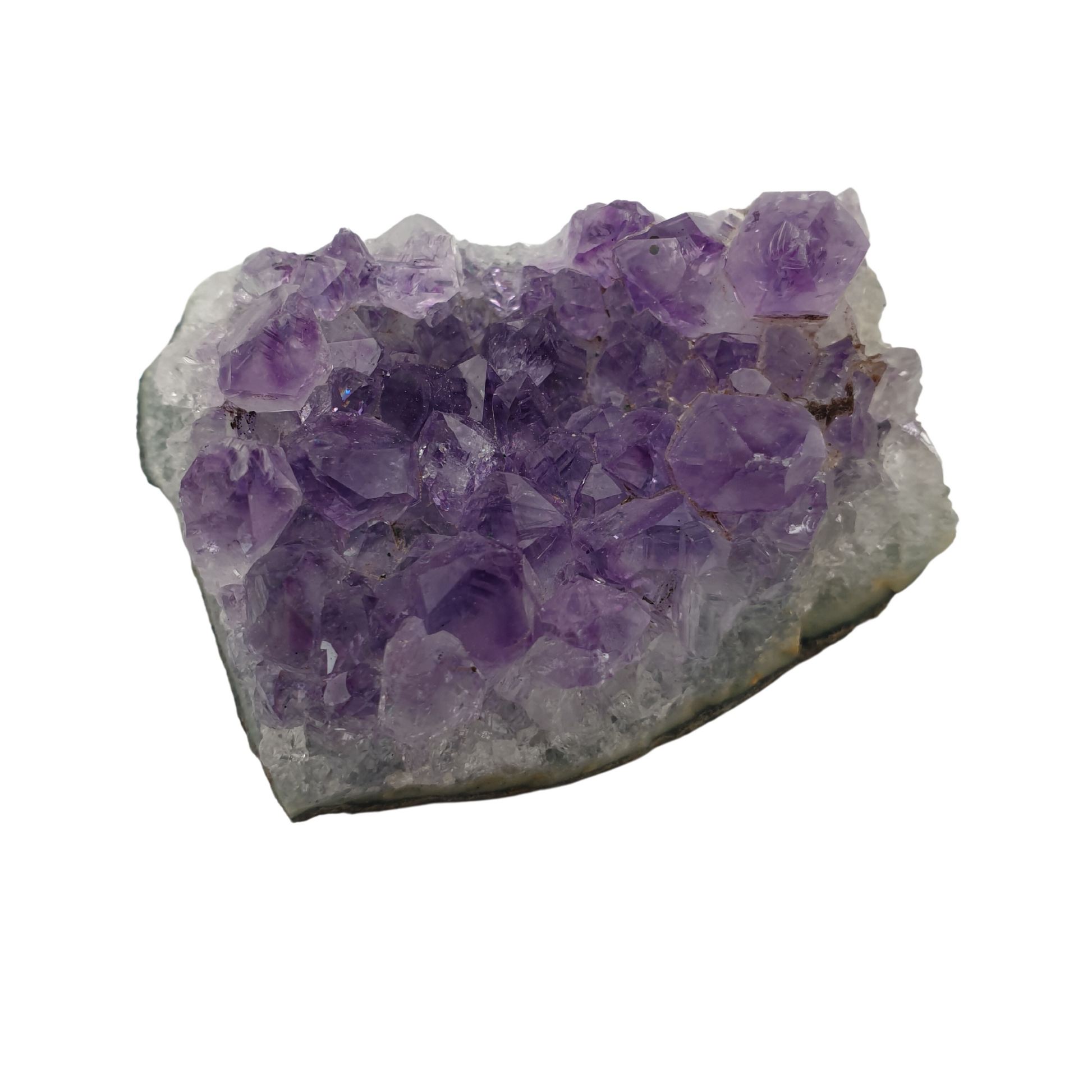 A piece of amethyst with purple points on a base of grey stone