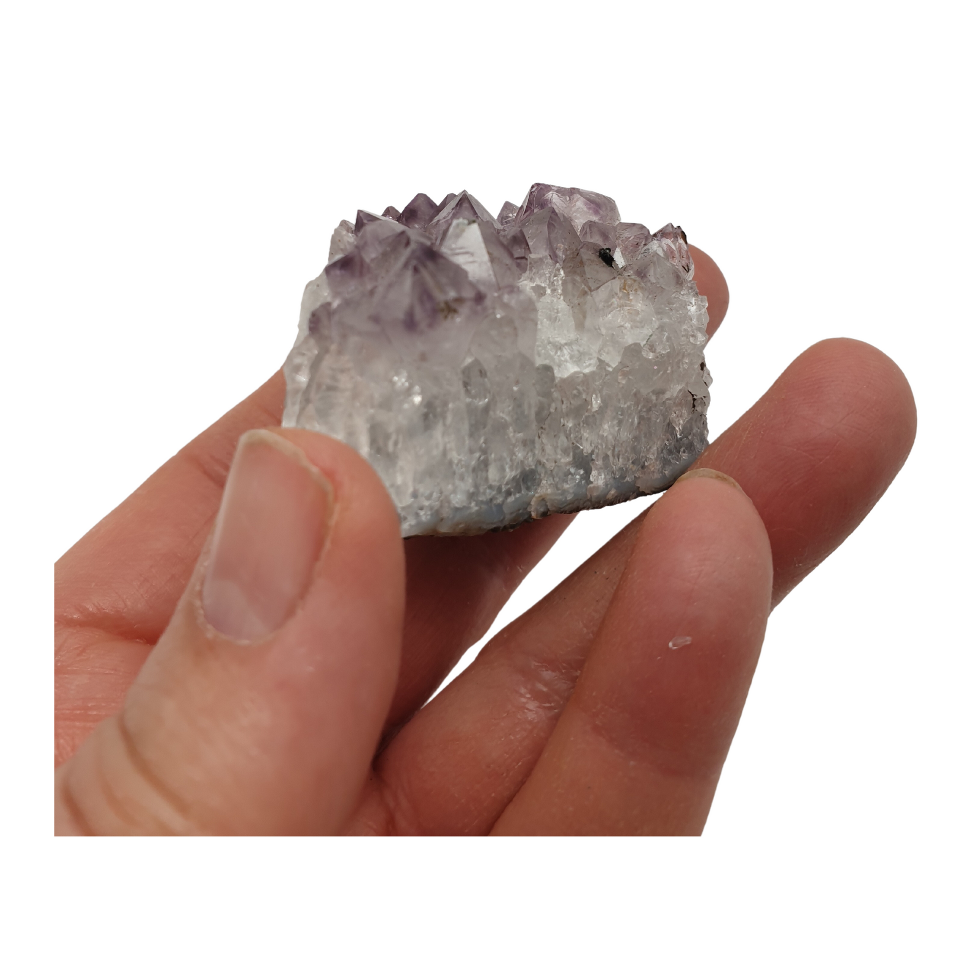 A hand holding a piece of amethyst with purple points on a base of grey stone