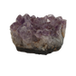 A piece of amethyst with purple points on a base of grey stone