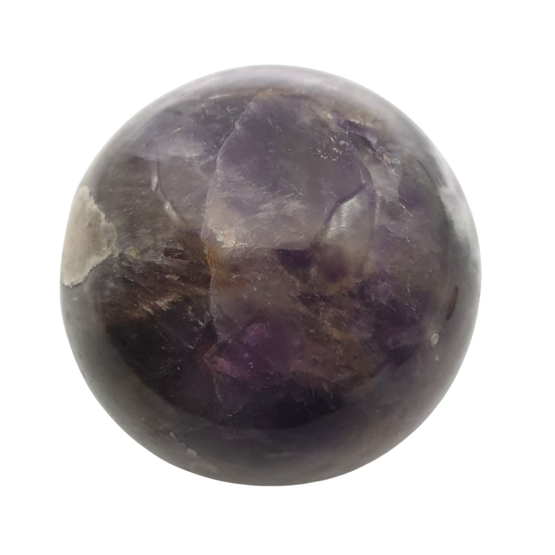 Amethyst Crystal carved into a sphere on a white background