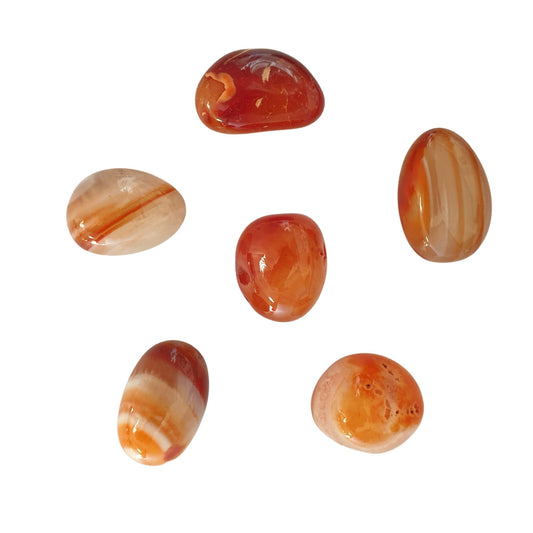 6 orange to creamy coloured Carnelian crystals that can fit in your hand to meditate